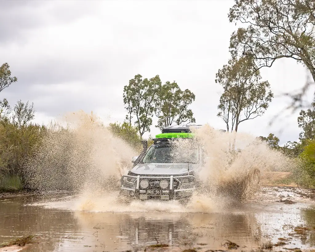 Ford Ranger driving through bog hole